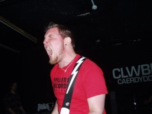Michael playing bass wearing Spillers Records shirt